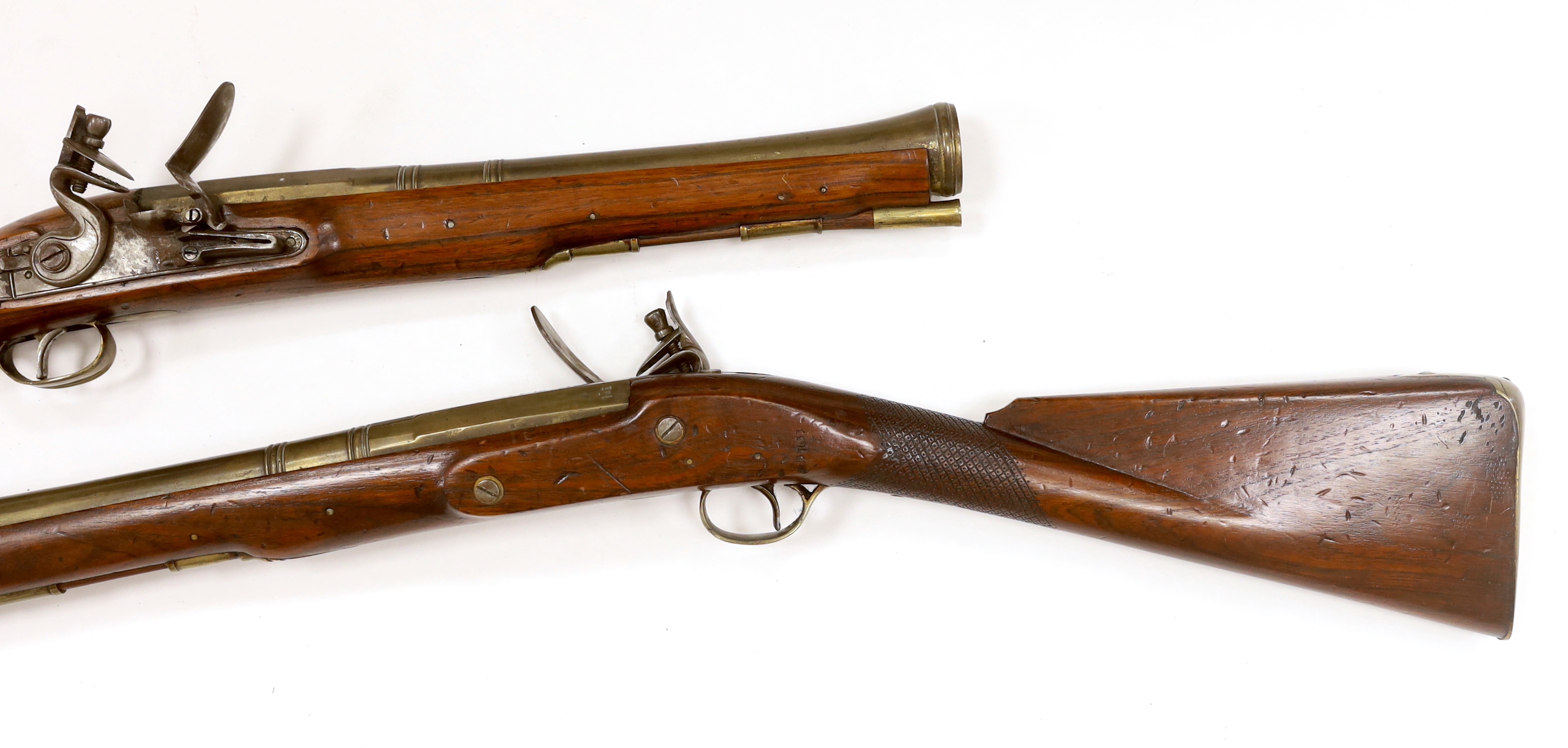 A pair of reproduction 'York Mail' flintlock blunderbusses in a late 18th century style.